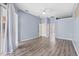 Spacious bedroom featuring hardwood floors, soft blue walls, and ample lighting at 8521 30Th E St, Parrish, FL 34219