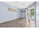 Light-filled bedroom with hardwood floors and access to outdoor patio at 8521 30Th E St, Parrish, FL 34219
