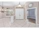 Welcoming foyer with tile flooring, a decorative mirror, and a clear view to other rooms at 8521 30Th E St, Parrish, FL 34219