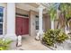 Elegant front entrance with stately columns, double doors, and decorative lion statues at 8521 30Th E St, Parrish, FL 34219