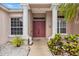 Elegant front entrance with stately columns, double doors, and decorative lion statues at 8521 30Th E St, Parrish, FL 34219