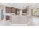 Bright kitchen features granite countertops, custom cabinets and stainless steel appliances at 8521 30Th E St, Parrish, FL 34219