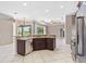 Gourmet kitchen features granite countertops, a stainless dishwasher, and a breakfast bar at 8521 30Th E St, Parrish, FL 34219