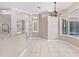 Bright and airy kitchen featuring a large granite island, stainless steel sink, and ample countertop space at 8521 30Th E St, Parrish, FL 34219