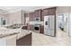 Open kitchen features stainless steel appliances, granite countertops and plenty of storage at 8521 30Th E St, Parrish, FL 34219