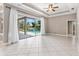 Bright living room with tile floors and sliding glass doors to pool area at 8521 30Th E St, Parrish, FL 34219