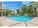 Relaxing screened pool with lush landscaping, offering a serene outdoor experience at 8521 30Th E St, Parrish, FL 34219