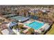 Aerial view of tennis courts, pool, clubhouse and other neighborhood amenities at 9418 W Park Village Dr # 105, Tampa, FL 33626