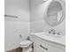 Bright bathroom featuring subway tile, white vanity, and an oval mirror at 9418 W Park Village Dr # 105, Tampa, FL 33626