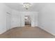 Spacious bedroom featuring a view of the en suite bathroom at 9418 W Park Village Dr # 105, Tampa, FL 33626