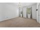 Spacious bedroom with carpet, large windows, and neutral decor at 9418 W Park Village Dr # 105, Tampa, FL 33626