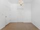 Spacious bedroom features double closets for optimal storage and neutral carpeting at 9418 W Park Village Dr # 105, Tampa, FL 33626