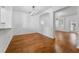 Dining space with hardwood floors, featuring an open layout to the kitchen and living area at 9418 W Park Village Dr # 105, Tampa, FL 33626