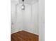 Bright entryway with dark hardwood floors and overhead light fixture at 9418 W Park Village Dr # 105, Tampa, FL 33626