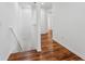 Hallway with hardwood floors leading to the upper level at 9418 W Park Village Dr # 105, Tampa, FL 33626