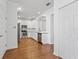 Spacious modern kitchen with white cabinets, stainless appliances and hardwood floors at 9418 W Park Village Dr # 105, Tampa, FL 33626