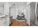 Cozy breakfast nook in kitchen features stainless steel appliances and stylish dining area at 9418 W Park Village Dr # 105, Tampa, FL 33626
