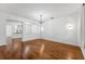 Bright living room with beautiful hardwood floors and an open layout at 9418 W Park Village Dr # 105, Tampa, FL 33626