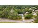 An aerial view of the property showcasing its location amidst lush greenery and neighborhood surroundings at 9602 N Rome Ave, Tampa, FL 33612