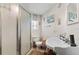 Simple bathroom featuring a shower, toilet, and pedestal sink at 9602 N Rome Ave, Tampa, FL 33612
