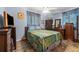 Cozy bedroom featuring unique tile flooring, a ceiling fan and blue accents at 9602 N Rome Ave, Tampa, FL 33612