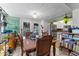 Cozy dining room next to a kitchen with a view to the backyard through glass patio doors at 9602 N Rome Ave, Tampa, FL 33612