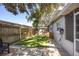 Well-maintained backyard with a fenced perimeter, shed and outdoor space with artificial turf at 10095 Oakhurst Rd, Seminole, FL 33776