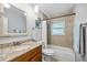 Charming bathroom featuring a tub, shower, and a granite countertop vanity with ample storage at 10095 Oakhurst Rd, Seminole, FL 33776