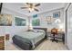 Cozy bedroom with a ceiling fan, light wood floors, and ample space to relax and unwind at 10095 Oakhurst Rd, Seminole, FL 33776