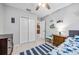 Cozy bedroom features a ceiling fan, a dresser, and a closet, perfect for a room or a guest room at 10095 Oakhurst Rd, Seminole, FL 33776