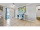 Inviting foyer with tiled floors, stylish console table, and bright natural light, creating a welcoming entrance at 10095 Oakhurst Rd, Seminole, FL 33776