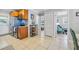Interior hallway showing sightlines from the kitchen to the bedrooms and common areas of the home at 10095 Oakhurst Rd, Seminole, FL 33776
