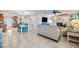 Spacious living room with a fireplace, tiled flooring, and comfortable seating, perfect for Gathering gatherings at 10095 Oakhurst Rd, Seminole, FL 33776
