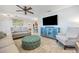 Spacious living room with stylish furnishings, a blue console table, and an inviting layout, perfect for entertaining at 10095 Oakhurst Rd, Seminole, FL 33776