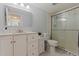 Clean bathroom with white vanity, stylish fixtures, and a glass-enclosed shower at 10423 Carrollbrook Cir # 203, Tampa, FL 33618