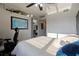Bright bedroom featuring a world map, closet, and adjacent dining area at 10423 Carrollbrook Cir # 203, Tampa, FL 33618