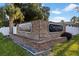 Carrollbrook Condominium entrance with brick sign and lush landscaping offers a welcoming and established community feel at 10423 Carrollbrook Cir # 203, Tampa, FL 33618