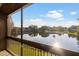 Scenic lake view from the screened lanai, offering a peaceful and serene setting at 10423 Carrollbrook Cir # 203, Tampa, FL 33618