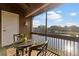 Screened lanai with seating, overlooking a tranquil lake, perfect for outdoor dining and relaxation at 10423 Carrollbrook Cir # 203, Tampa, FL 33618