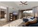Bright living room featuring vaulted ceilings, sliding glass doors to lanai, and stylish decor at 10423 Carrollbrook Cir # 203, Tampa, FL 33618