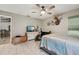 Bedroom featuring tiled flooring, exercise equipment, mounted deer head, and a wall-mounted TV at 10614 Hudson Ave, Hudson, FL 34669