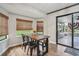 Cozy dining area adjacent to the kitchen, perfect for Gathering meals and entertaining guests at 10614 Hudson Ave, Hudson, FL 34669