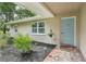 Inviting front porch with decorative tile and landscaping at 10614 Hudson Ave, Hudson, FL 34669