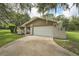 Spacious two-car garage and driveway offer ample parking space for residents and guests at 10614 Hudson Ave, Hudson, FL 34669