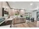 Beautiful kitchen featuring stainless steel appliances, updated cabinets, and a herringbone backsplash at 10614 Hudson Ave, Hudson, FL 34669