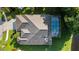 Aerial view of a home with a screened pool and well-maintained landscaping in a desirable neighborhood at 10751 Tavistock Dr, Tampa, FL 33626