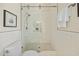 Modern bathroom featuring white subway tile, a glass-enclosed shower, and a toilet at 10751 Tavistock Dr, Tampa, FL 33626