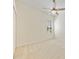 Spacious bedroom with neutral carpet, ceiling fan, window, and closet at 10751 Tavistock Dr, Tampa, FL 33626