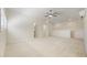 Large, bright bonus room featuring neutral carpet and paint, recessed lighting, and a ceiling fan at 10751 Tavistock Dr, Tampa, FL 33626