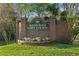 The Westchase Golf Course entrance includes brick signage and manicured flower beds at 10751 Tavistock Dr, Tampa, FL 33626